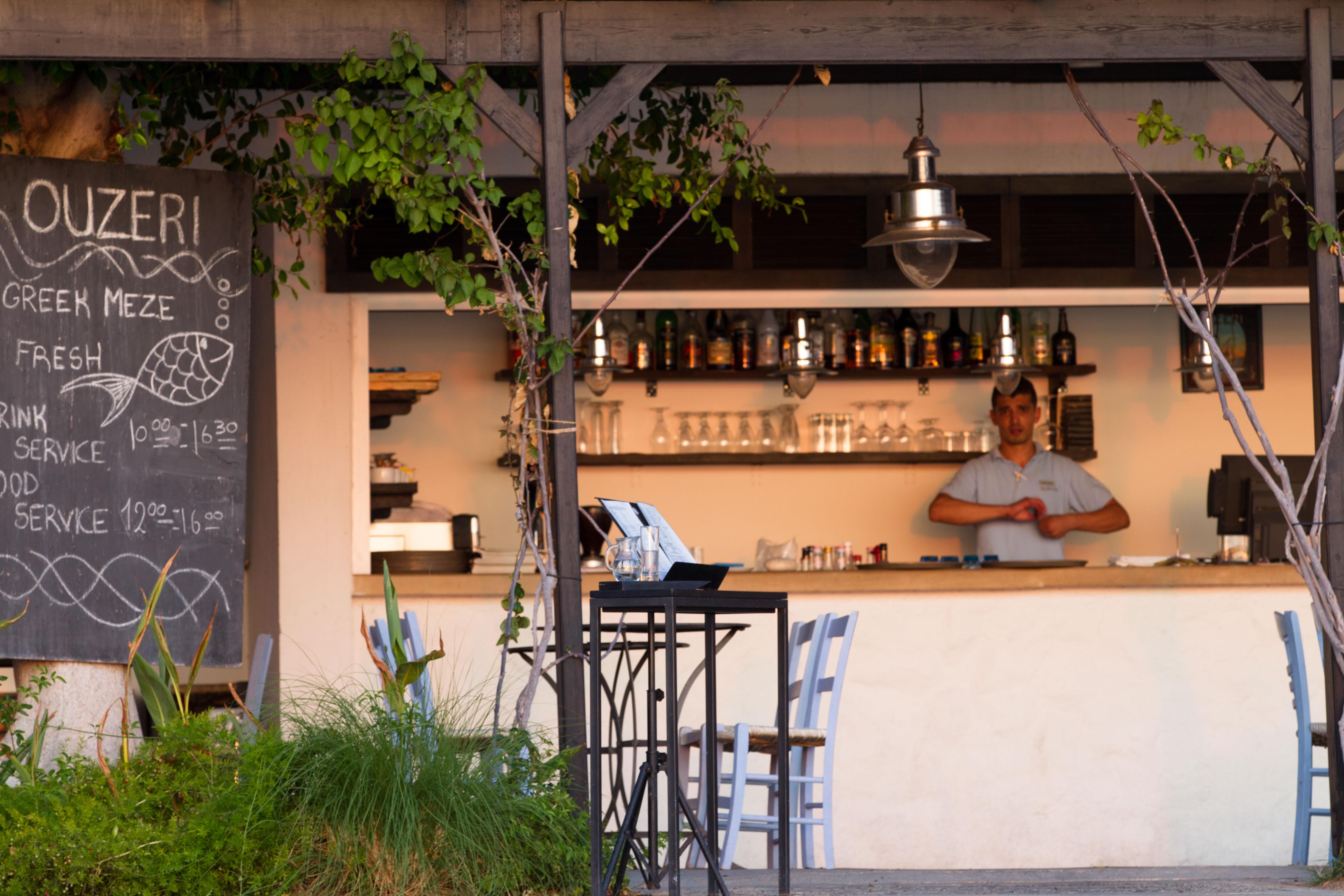Almyra Hotel Paphos Bagian luar foto A tavern in Athens