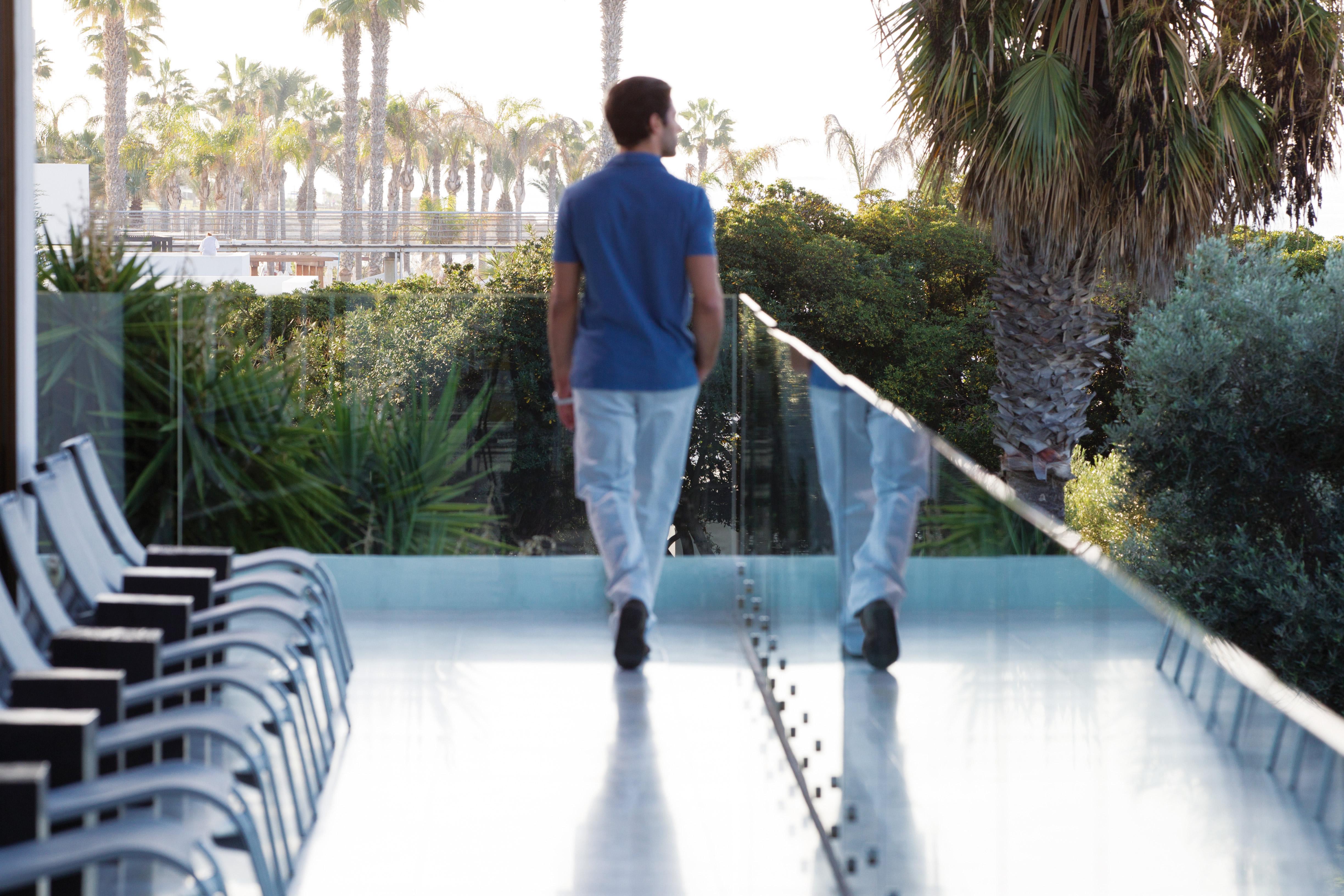 Almyra Hotel Paphos Bagian luar foto A man walking