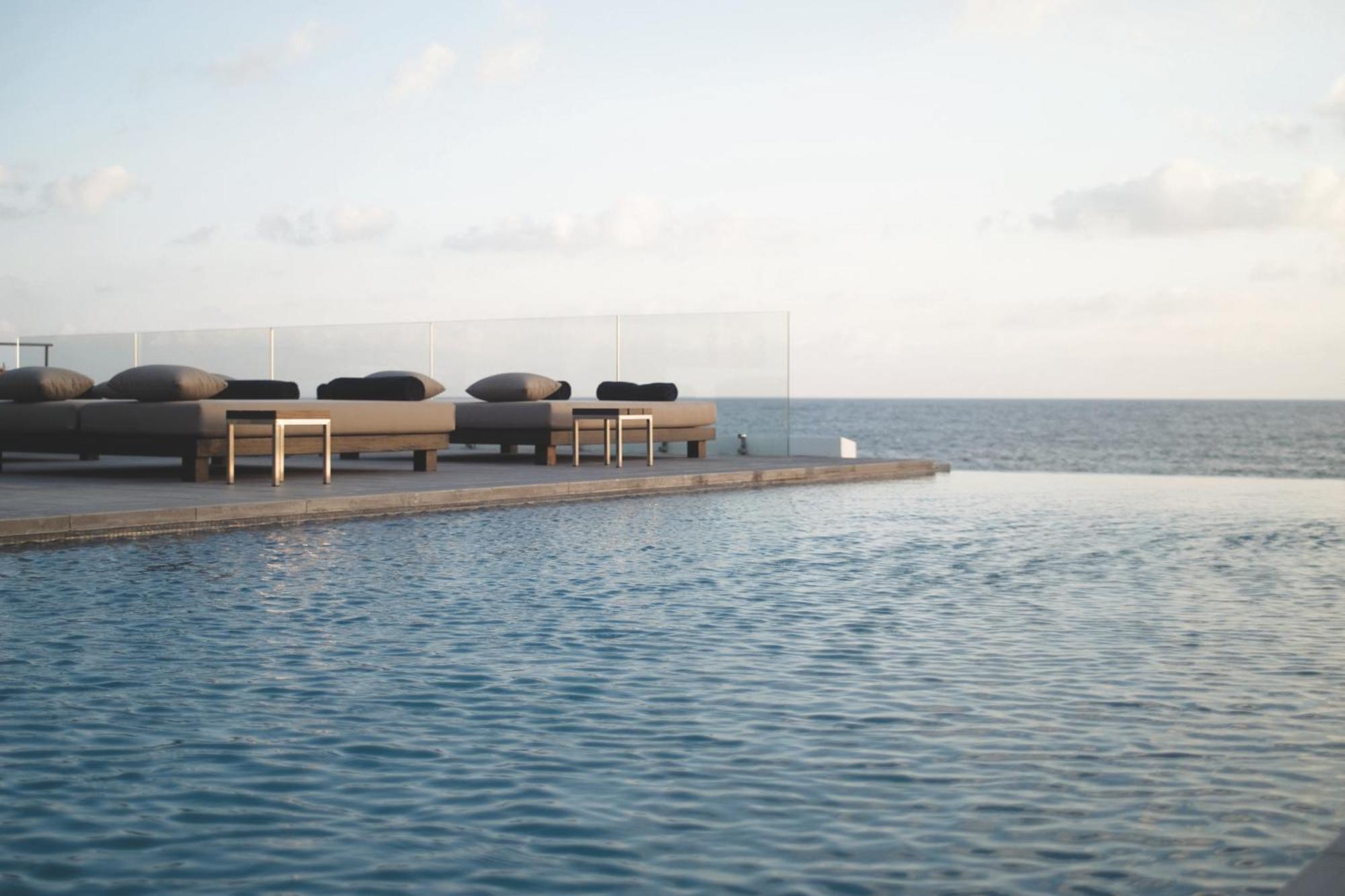 Almyra Hotel Paphos Bagian luar foto The pool at the hotel