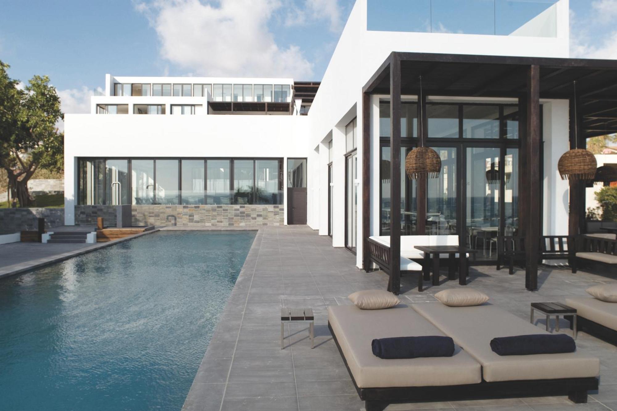 Almyra Hotel Paphos Bagian luar foto The hotel's pool